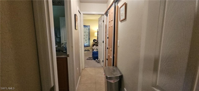 hallway featuring light tile patterned floors