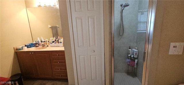 bathroom featuring vanity and a shower with door