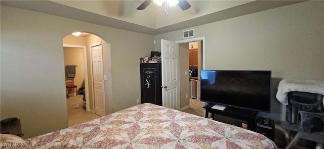 bedroom featuring ceiling fan and radiator