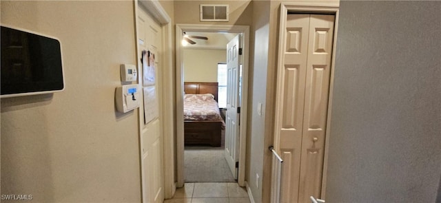 corridor with light tile patterned flooring