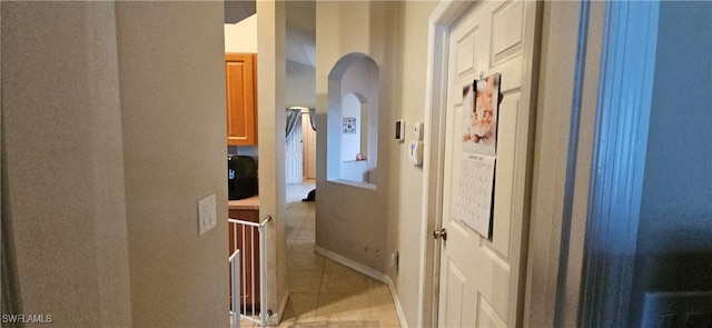 hallway featuring light tile patterned floors