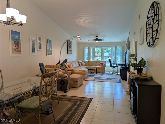 tiled living room featuring ceiling fan with notable chandelier