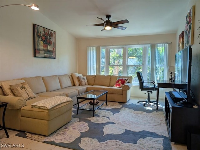 tiled living room with vaulted ceiling and ceiling fan