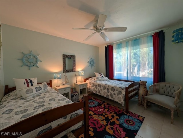 tiled bedroom with ceiling fan