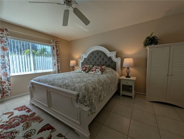 tiled bedroom with ceiling fan