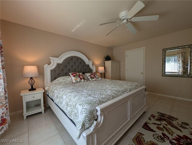 tiled bedroom featuring ceiling fan