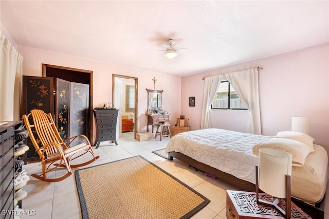 bedroom with ceiling fan and light tile patterned floors