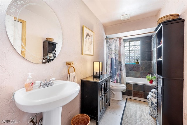 full bathroom with toilet, shower / tub combo, tile patterned floors, and sink