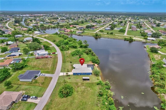 bird's eye view featuring a water view and a residential view