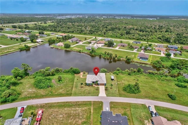 birds eye view of property featuring a water view and a residential view