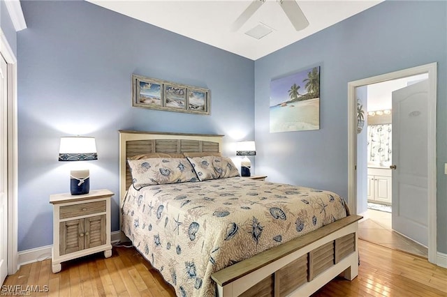 bedroom featuring wood-type flooring, baseboards, ceiling fan, and connected bathroom