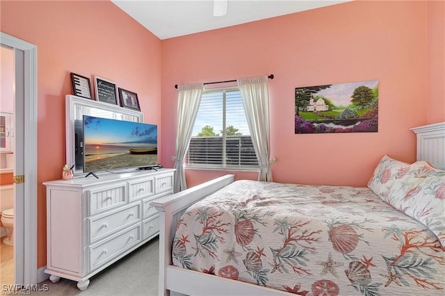 bedroom with light carpet and a ceiling fan