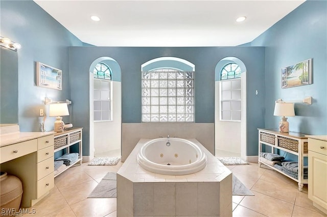 full bath with a walk in shower, recessed lighting, vanity, a jetted tub, and tile patterned floors