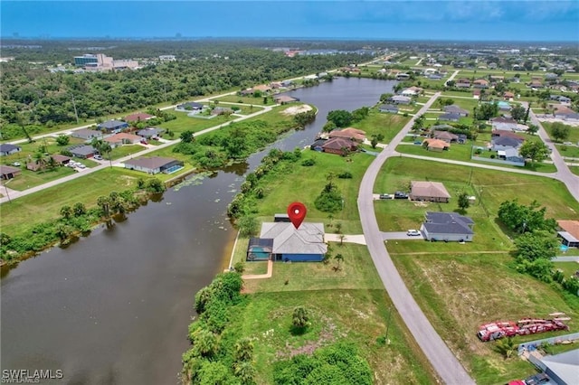 aerial view featuring a water view and a residential view