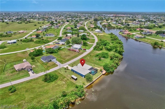 aerial view featuring a water view and a residential view