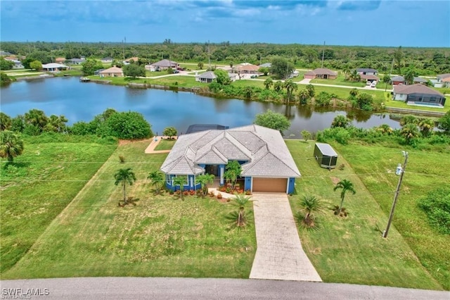 bird's eye view featuring a water view and a residential view