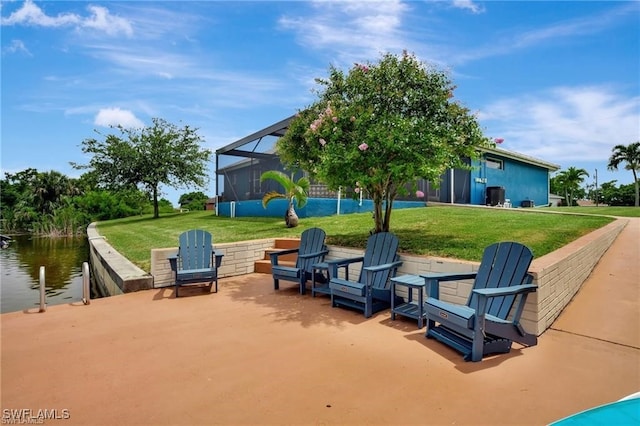 view of patio / terrace with glass enclosure and a water view