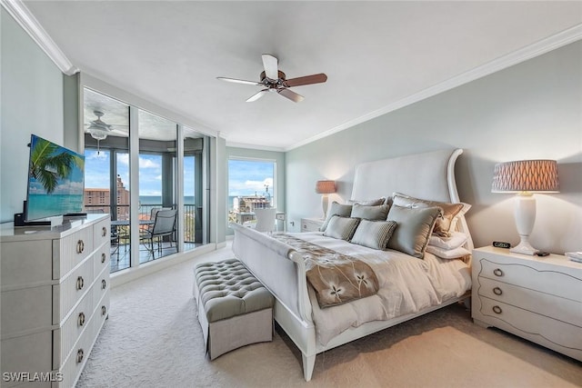 carpeted bedroom featuring ceiling fan, access to outside, and ornamental molding