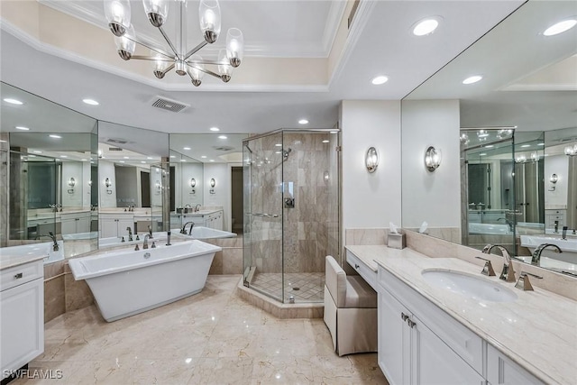 bathroom with ornamental molding, an inviting chandelier, plus walk in shower, and vanity