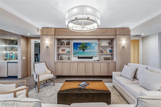 living room with light hardwood / wood-style floors and built in shelves