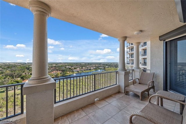 balcony featuring a water view