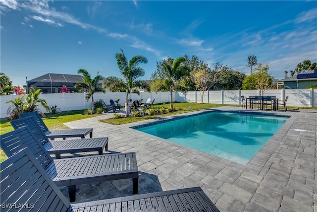 view of swimming pool with a patio area