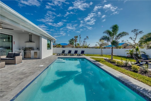 view of pool featuring grilling area, a patio area, and area for grilling