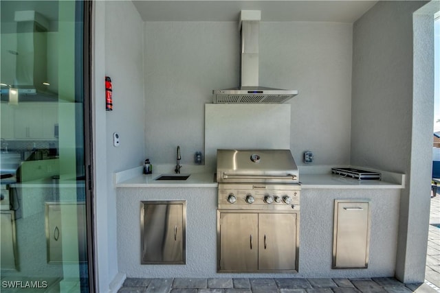 view of patio / terrace with exterior kitchen, sink, and area for grilling