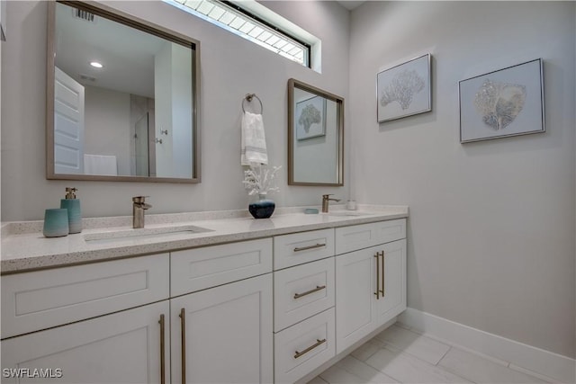 bathroom with vanity and tile patterned floors