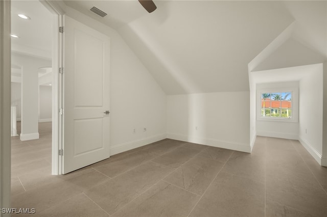 bonus room with lofted ceiling and ceiling fan