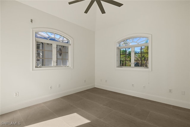 tiled empty room with ceiling fan