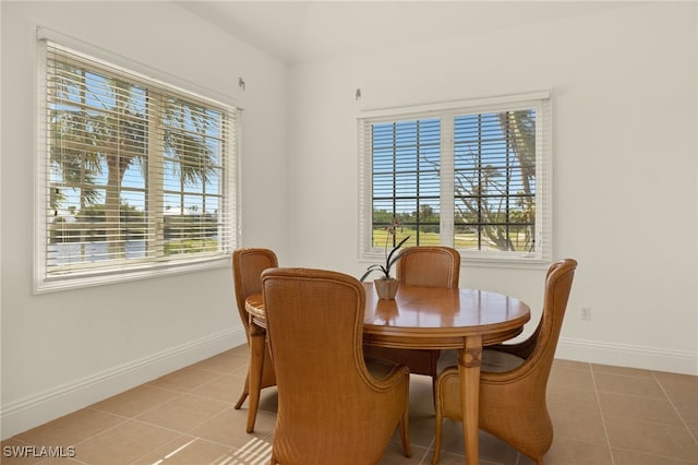 dining area with light tile patterned floors