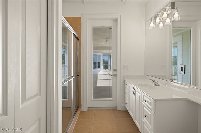 bathroom featuring tile patterned flooring and vanity