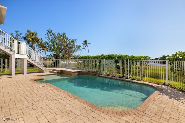 view of swimming pool featuring a patio area