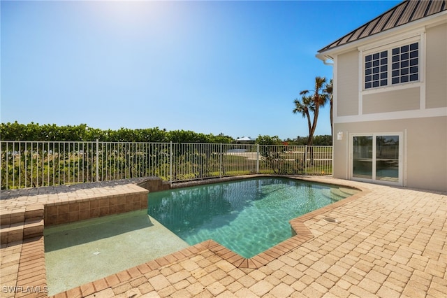 view of pool featuring a patio