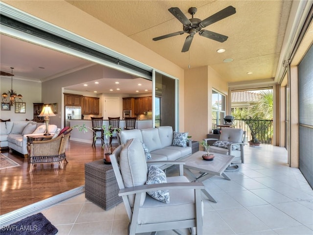 exterior space with ceiling fan, exterior bar, and an outdoor hangout area