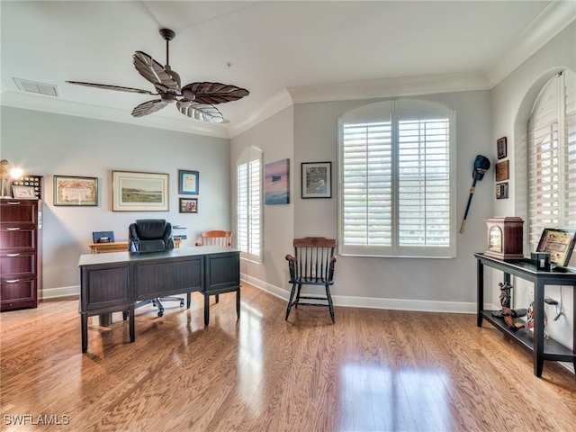 office area featuring ornamental molding, light wood-type flooring, and ceiling fan