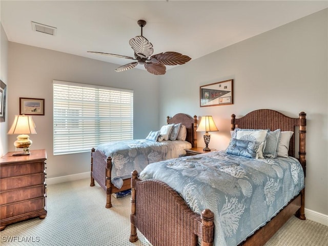 bedroom featuring ceiling fan and light carpet