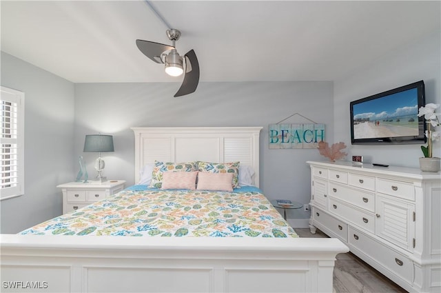 bedroom featuring wood-type flooring and ceiling fan