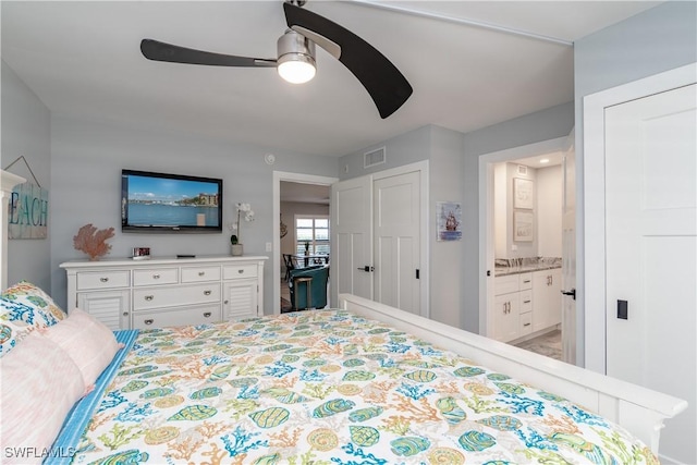 bedroom with ceiling fan and connected bathroom