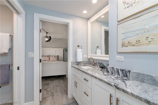 bathroom featuring vanity and hardwood / wood-style flooring