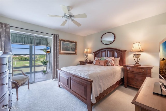 bedroom featuring ceiling fan and light colored carpet