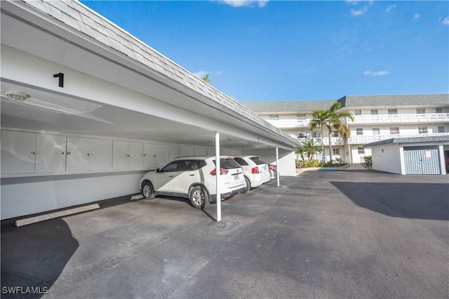 view of parking / parking lot featuring a carport