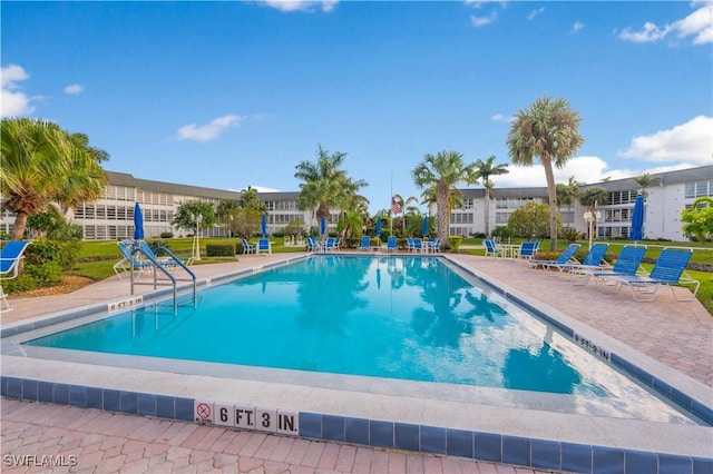 view of swimming pool featuring a patio