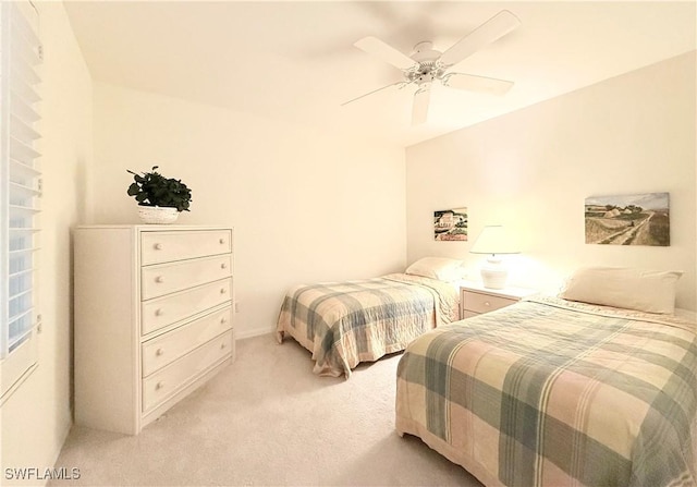 bedroom with light carpet and ceiling fan