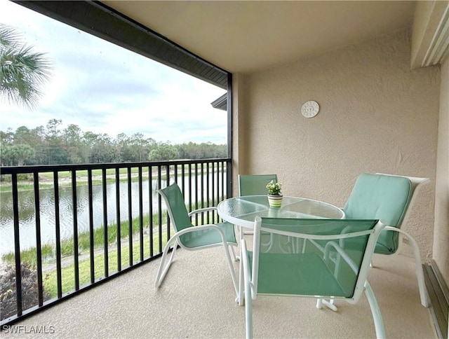 balcony featuring a water view