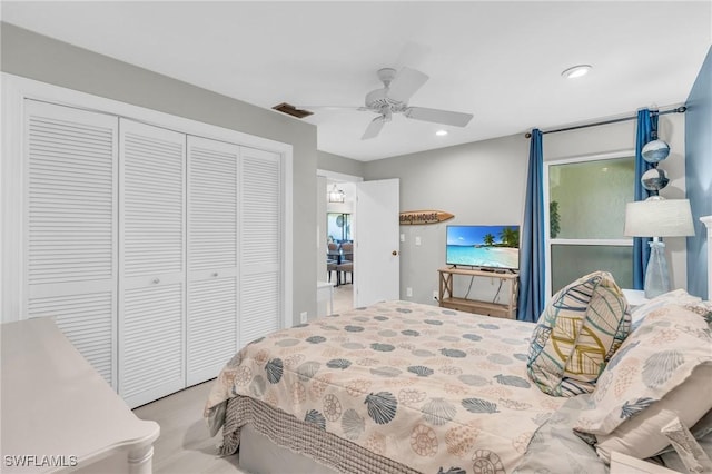 bedroom featuring ceiling fan and a closet