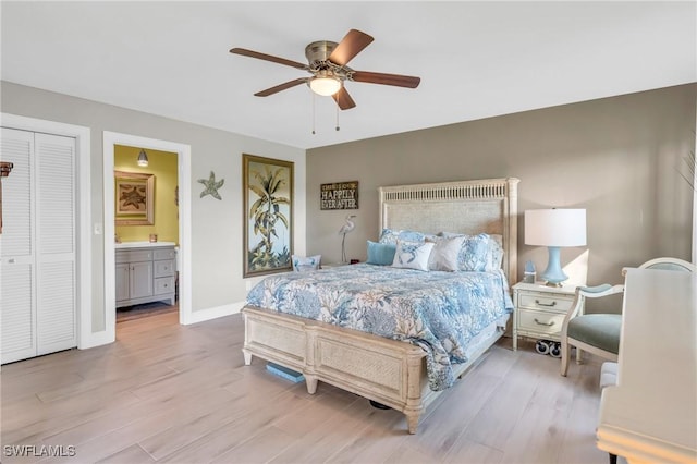 bedroom with ensuite bath, ceiling fan, and light wood-type flooring