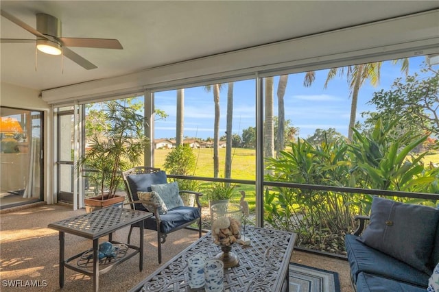 sunroom / solarium with ceiling fan