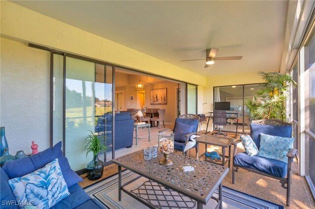 sunroom / solarium with ceiling fan